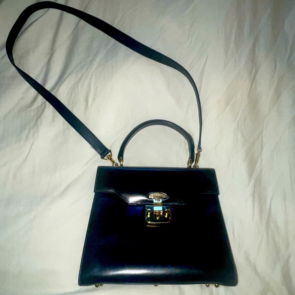 Gucci vintage lady lock top handle satchel.